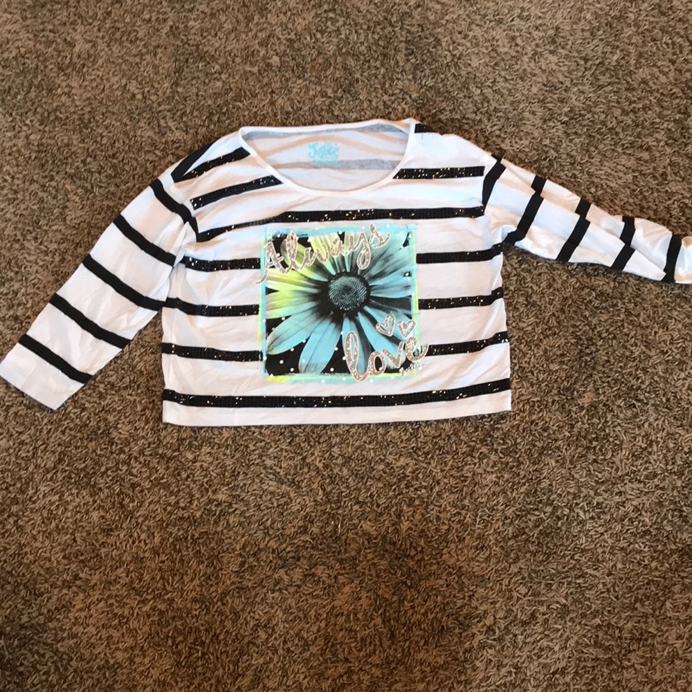 Never worn 3/4 sleeve justice shirt. Half shirt